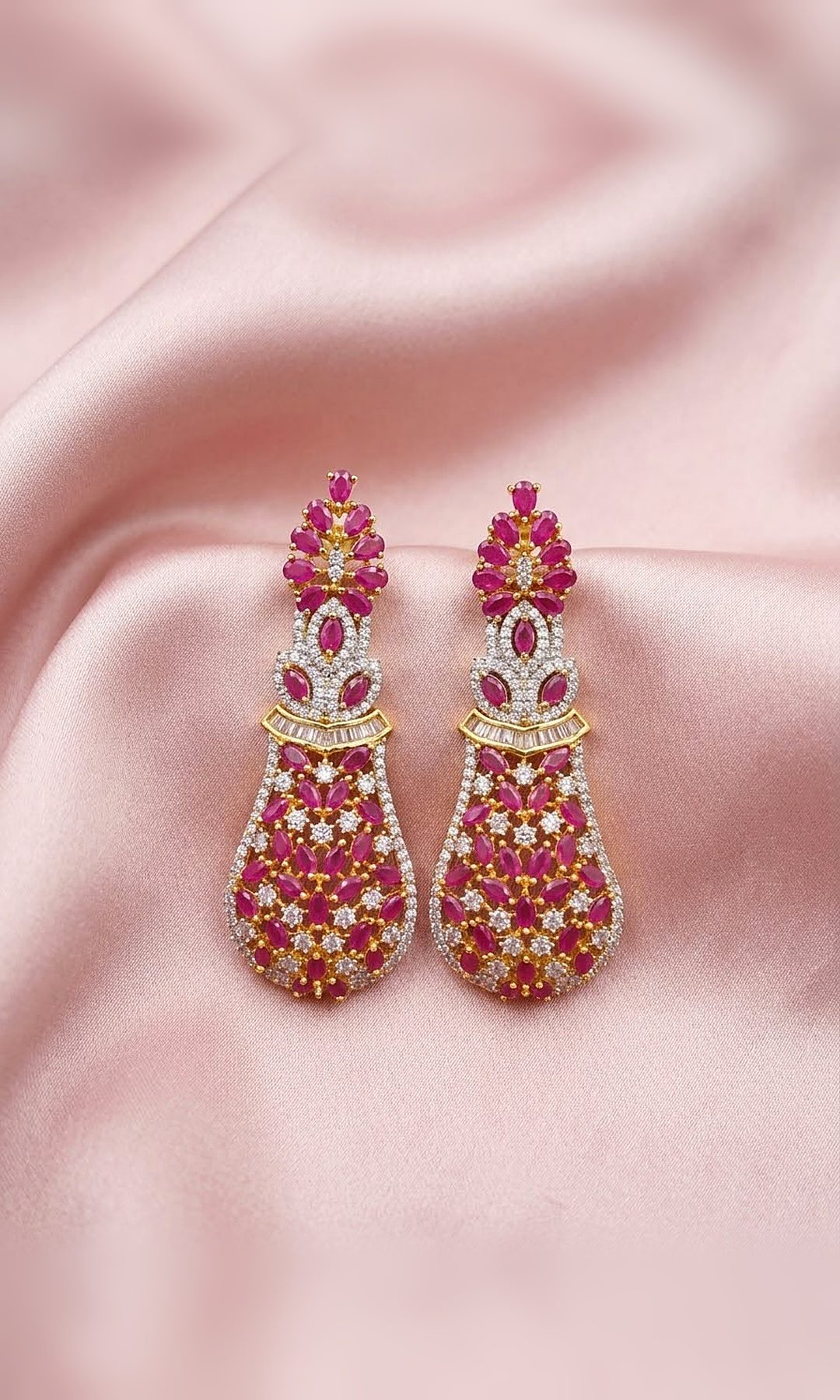 Ruby Pink Diamond-Look Drop Earrings — Gold-tone long drops set with ruby-pink marquise stones and diamond-look crystals, with a baguette-stone band.