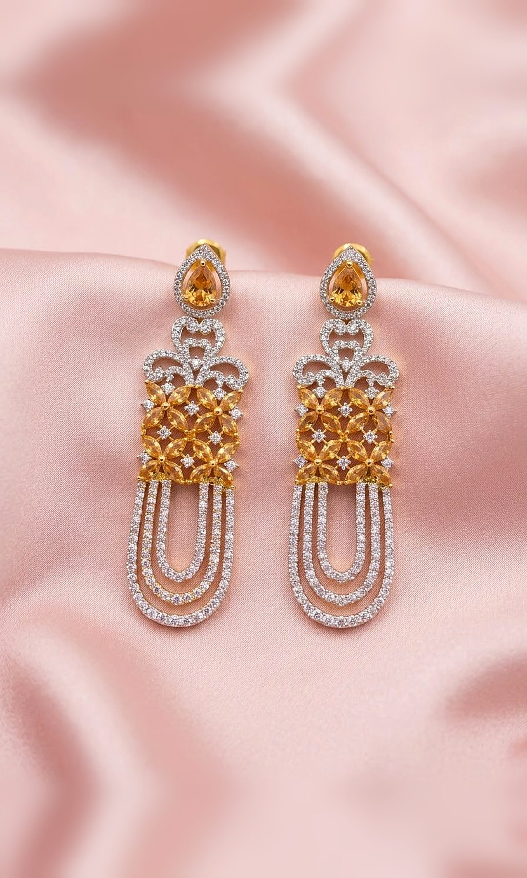 Champagne Floral Long Earrings — Two-tone long earrings with a champagne marquise flower panel, diamond-look scrollwork and three looped strands of crystals.