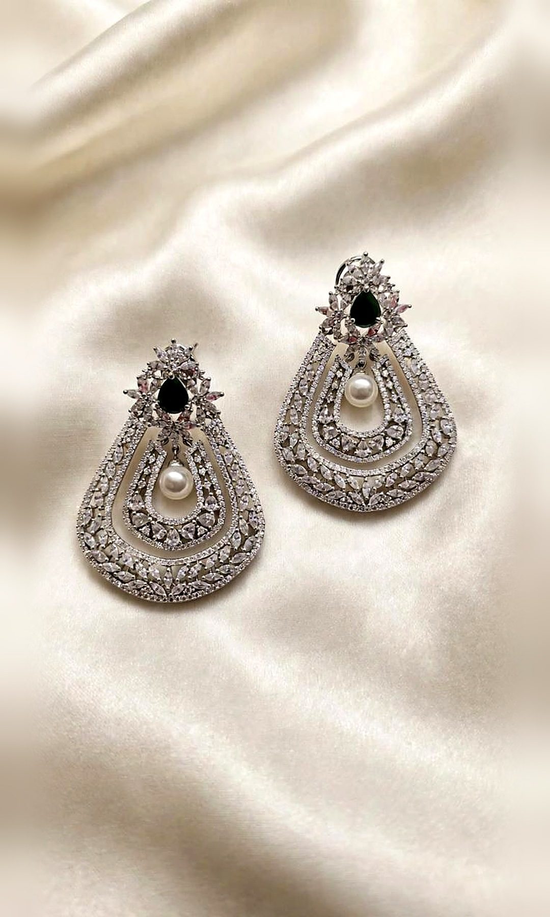 Emerald & Pearl Teardrop Earrings — Large silver-tone teardrop earrings layered with marquise stones, an emerald-green crest and a pearl drop.