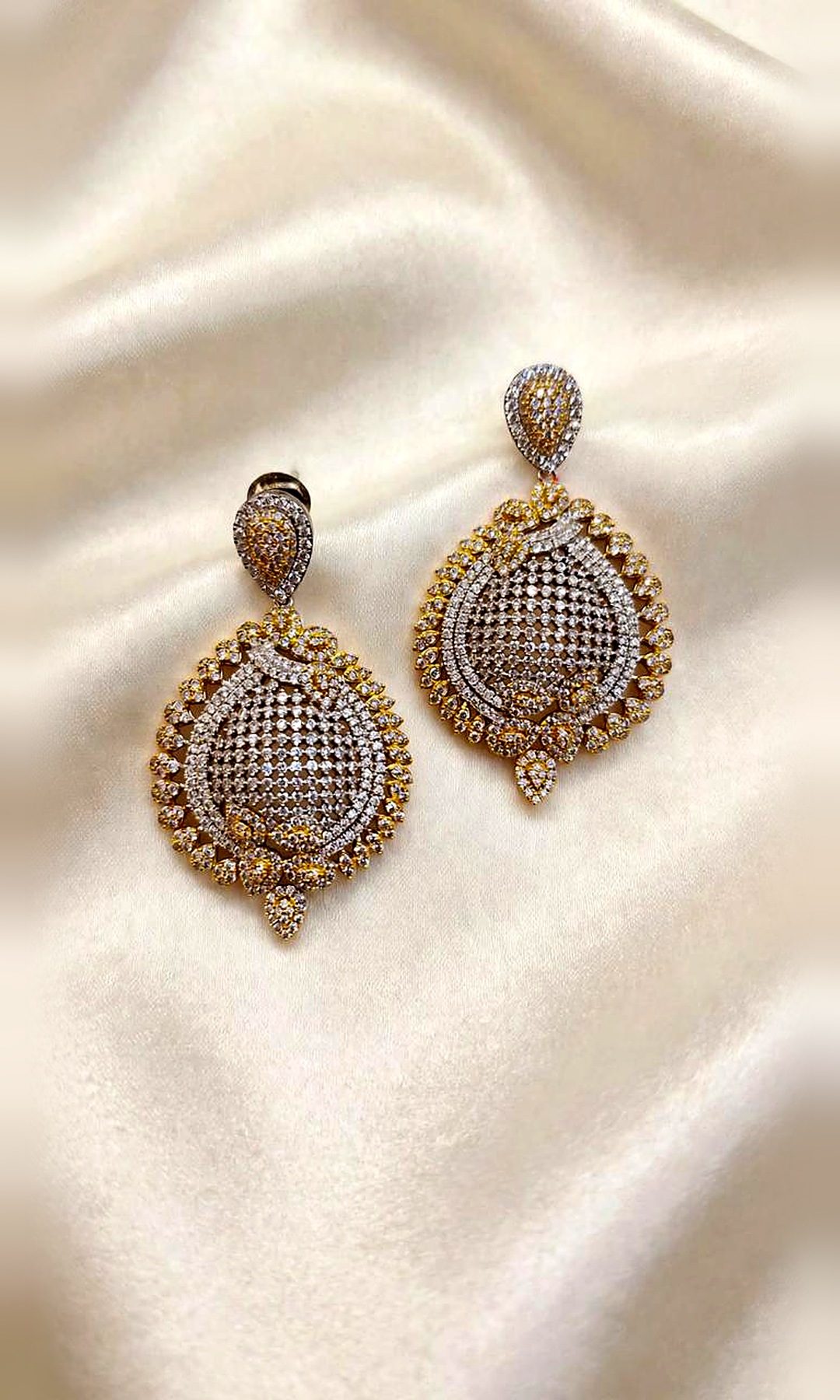 Two-Tone Pavé Round Earrings — Gold and silver-tone round drops with a pavé lattice centre, a scalloped gold border and a pear stud.