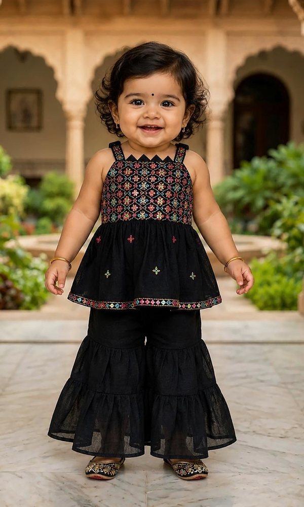 Black Embroidered Sharara Set — Black sharara set with a jewel-tone thread-embroidered yoke, scattered motifs and a colourful border — playful, festive and made for twirling.