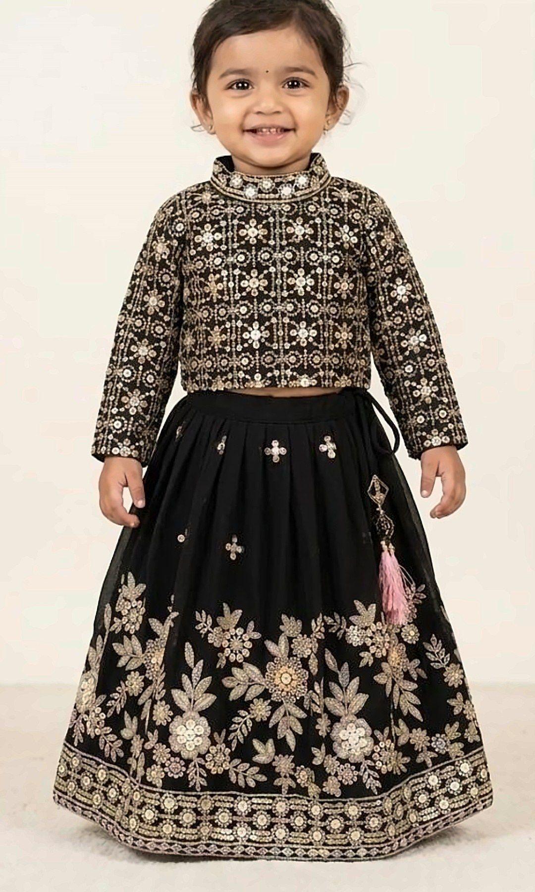 Black Sequinned Lehenga Choli — Black lehenga choli with a high-neck sequinned blouse and a rich floral-embroidered hem — a little luxury piece for grand occasions.