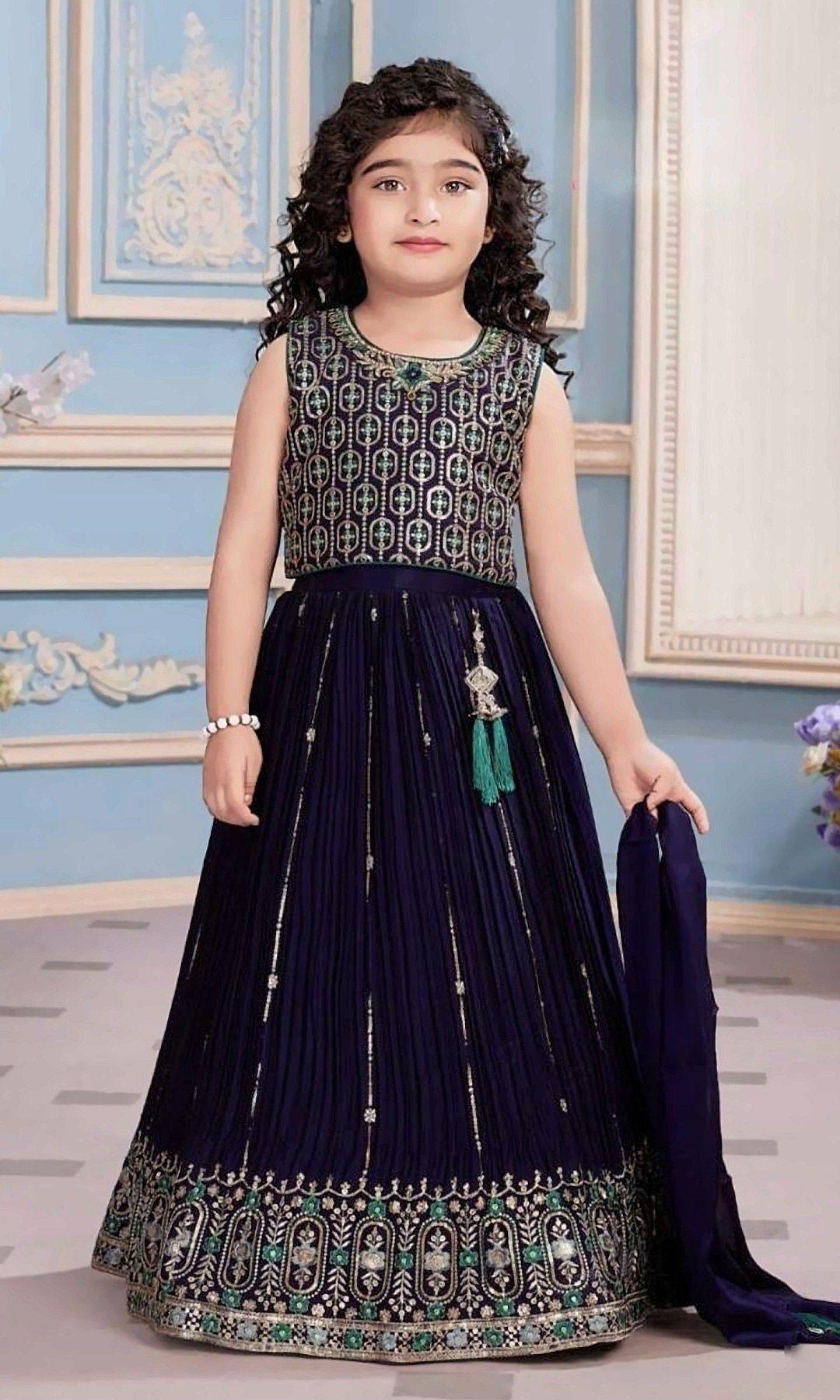 Navy Sequin Lehenga Choli — Navy blue lehenga choli with a geometric sequin-embroidered blouse, pleated skirt, rich teal-and-gold embroidered hem and a matching dupatta.