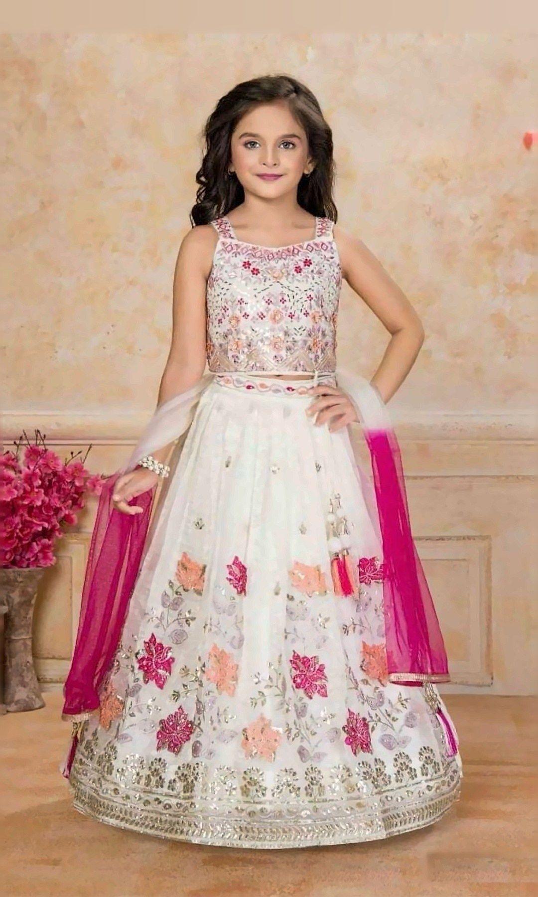 Ivory Floral Lehenga with Rani Dupatta — Ivory lehenga with pink and peach floral embroidery, a matching embellished blouse and a bright rani-pink net dupatta.