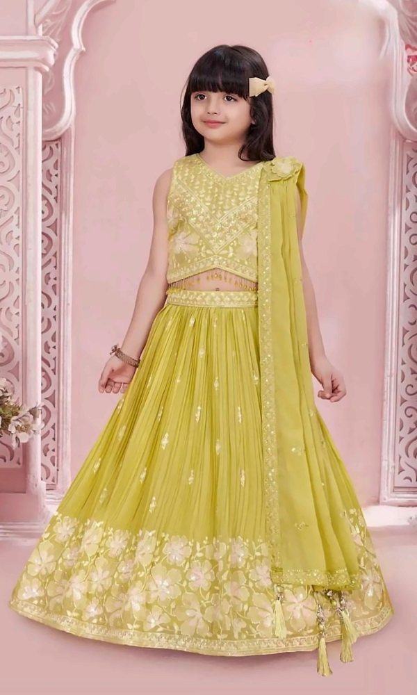 Lime Yellow Pleated Lehenga — Lime-yellow pleated lehenga with a tonal floral sequin border, V-neck embroidered blouse with tassels and a draped dupatta.