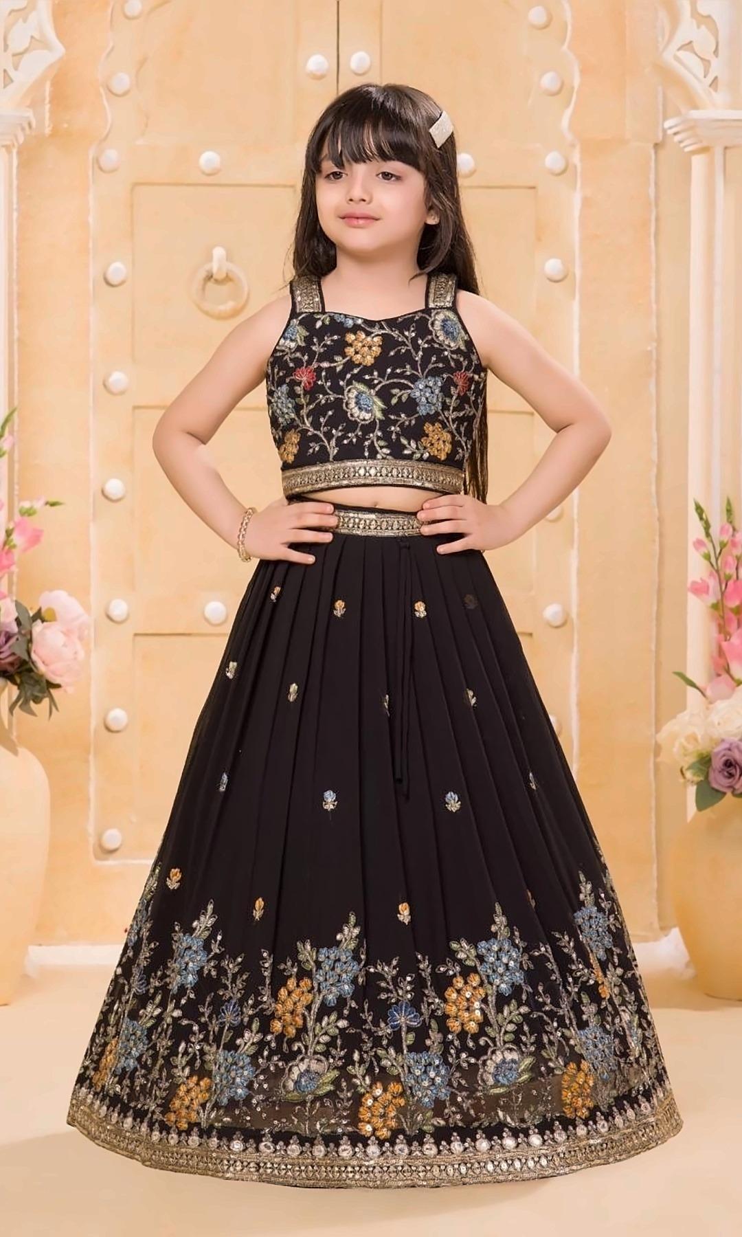 Black Floral Lehenga Choli — Black georgette lehenga with colourful floral and sequin embroidery, an embroidered crop top and a gold border.