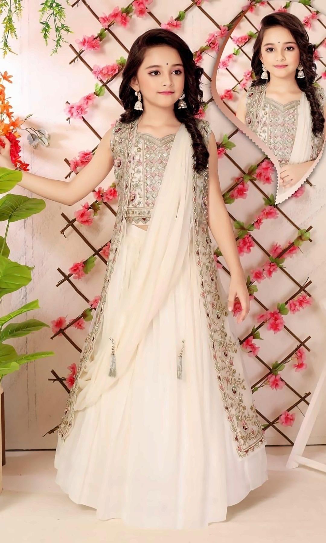 Ivory Lehenga with Long Jacket — Ivory crop top and lehenga with an embroidered long jacket in pink and sage, and an attached draped dupatta with tassels.