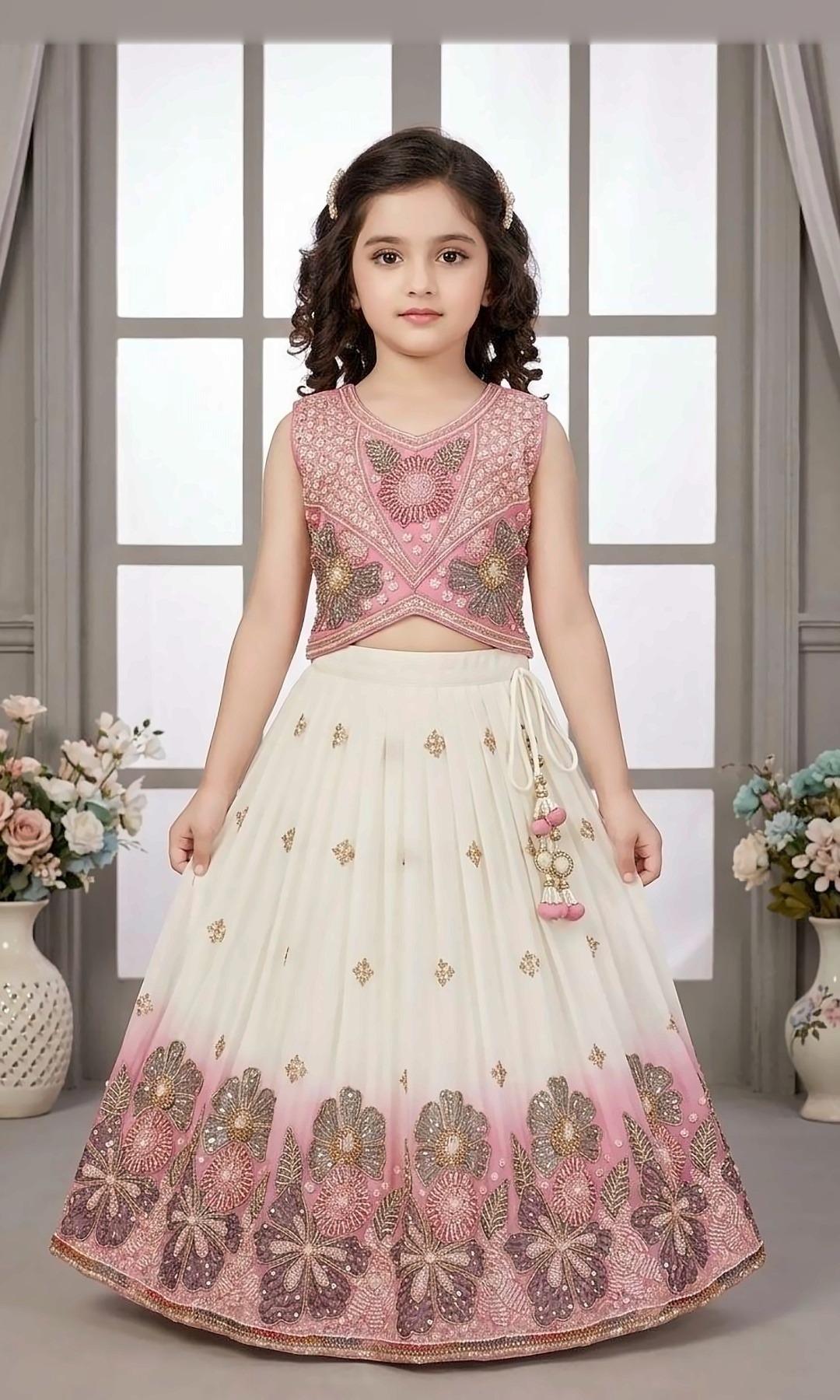 Ivory & Pink Ombré Lehenga — Ivory lehenga with a pink ombré hem and sequin flower embroidery, and a beaded pink crop top with a latkan tie.