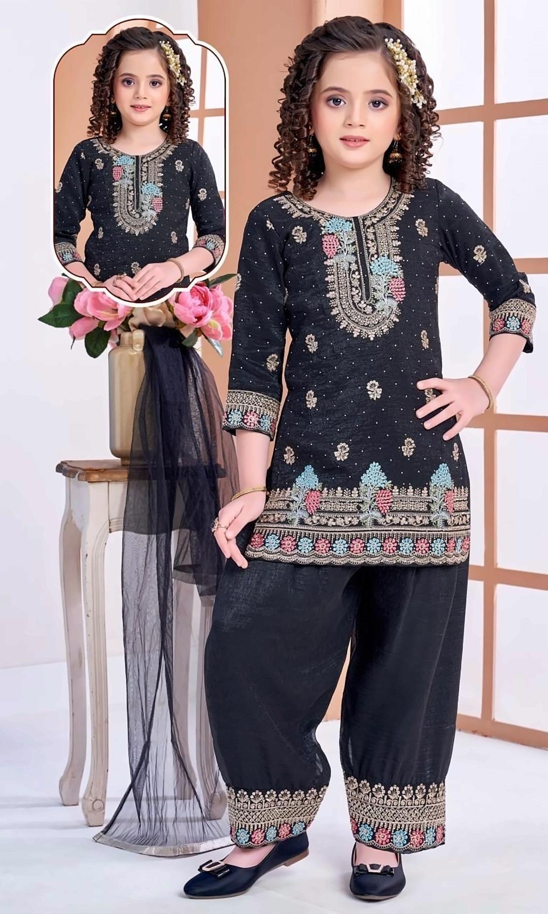 Black Embroidered Afghani Salwar Set — Black kurta with a colourful floral yoke, sequin dots and an embroidered hem, an Afghani salwar with embroidered cuffs and a black net dupatta.