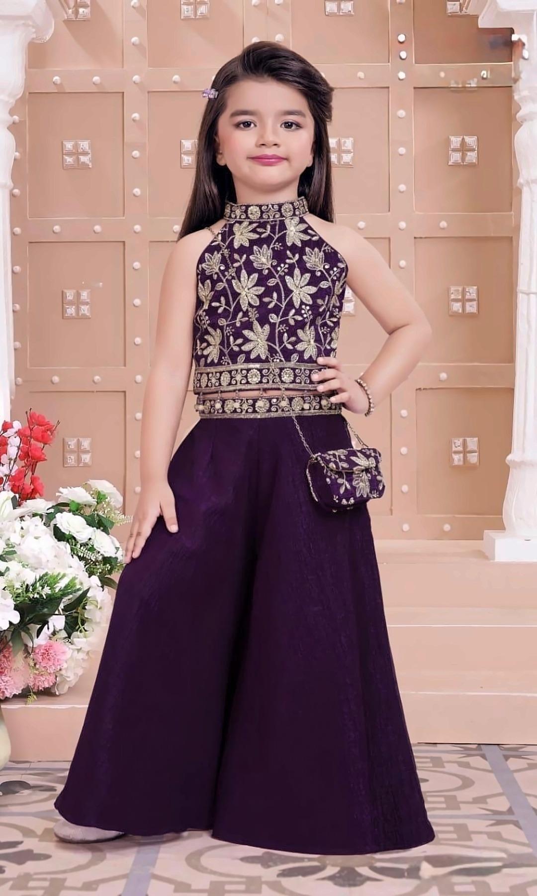 Plum Halter Palazzo Set — Plum halter-neck crop top with gold floral embroidery and a beaded hem, a wide palazzo and a matching sling bag.