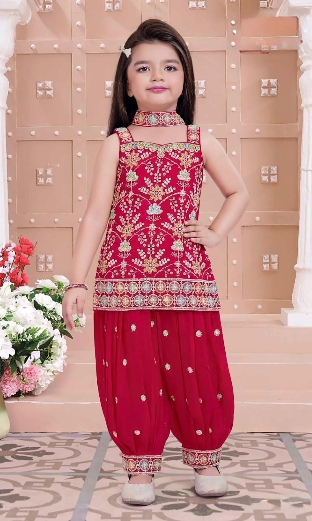 Red Embroidered Dhoti Set — Sleeveless red kurti with colourful thread and sequin embroidery, embroidered dhoti pants and a matching choker.