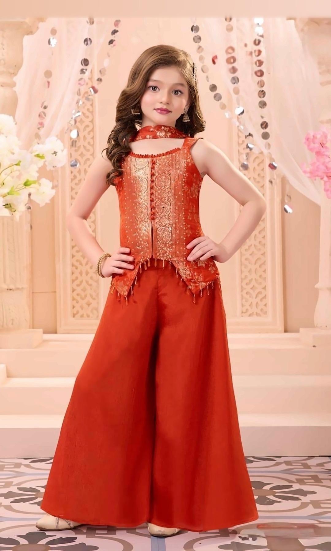 Rust Brocade Jacket Palazzo Set — Rust orange brocade jacket-style top with a button placket and bead tassels, a wide palazzo and a matching scarf.