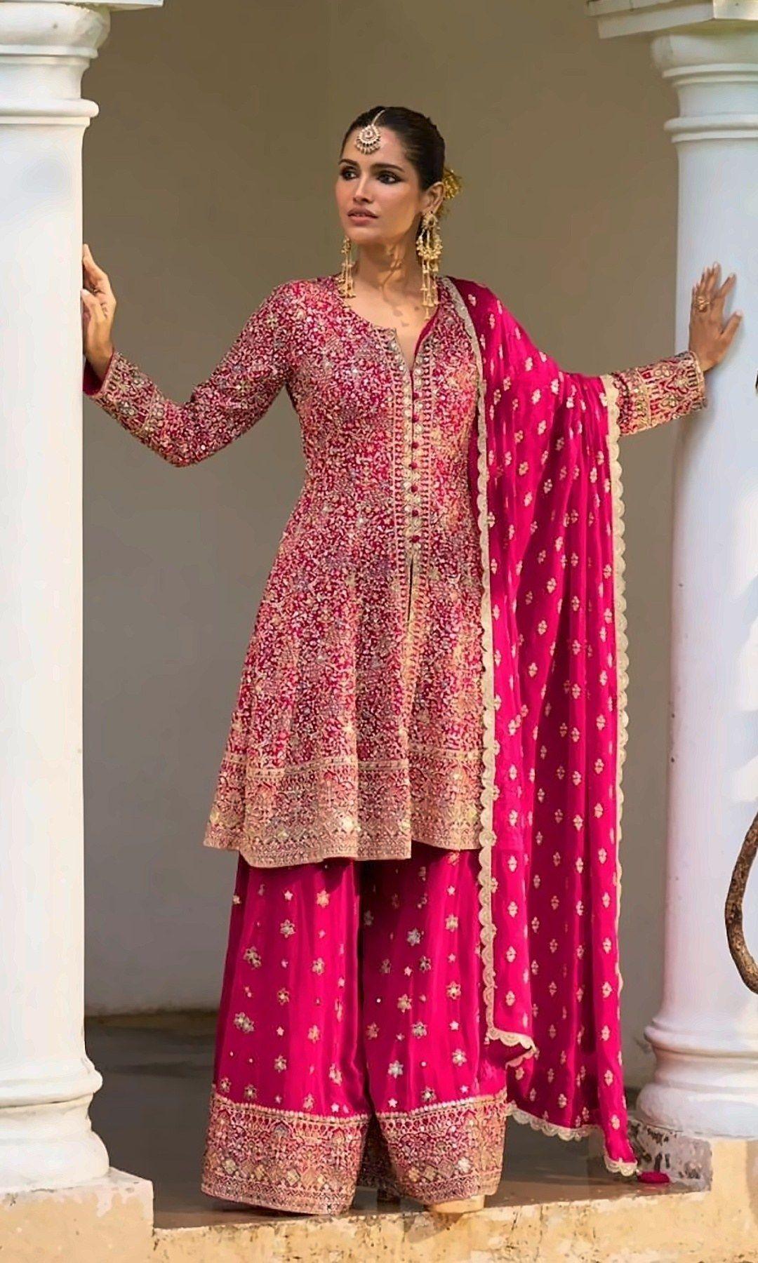 Rani Pink Peplum Sharara Suit — Rani pink peplum kurta sparkling with sequins, paired with an embroidered-border sharara and a lace-edged butti dupatta.