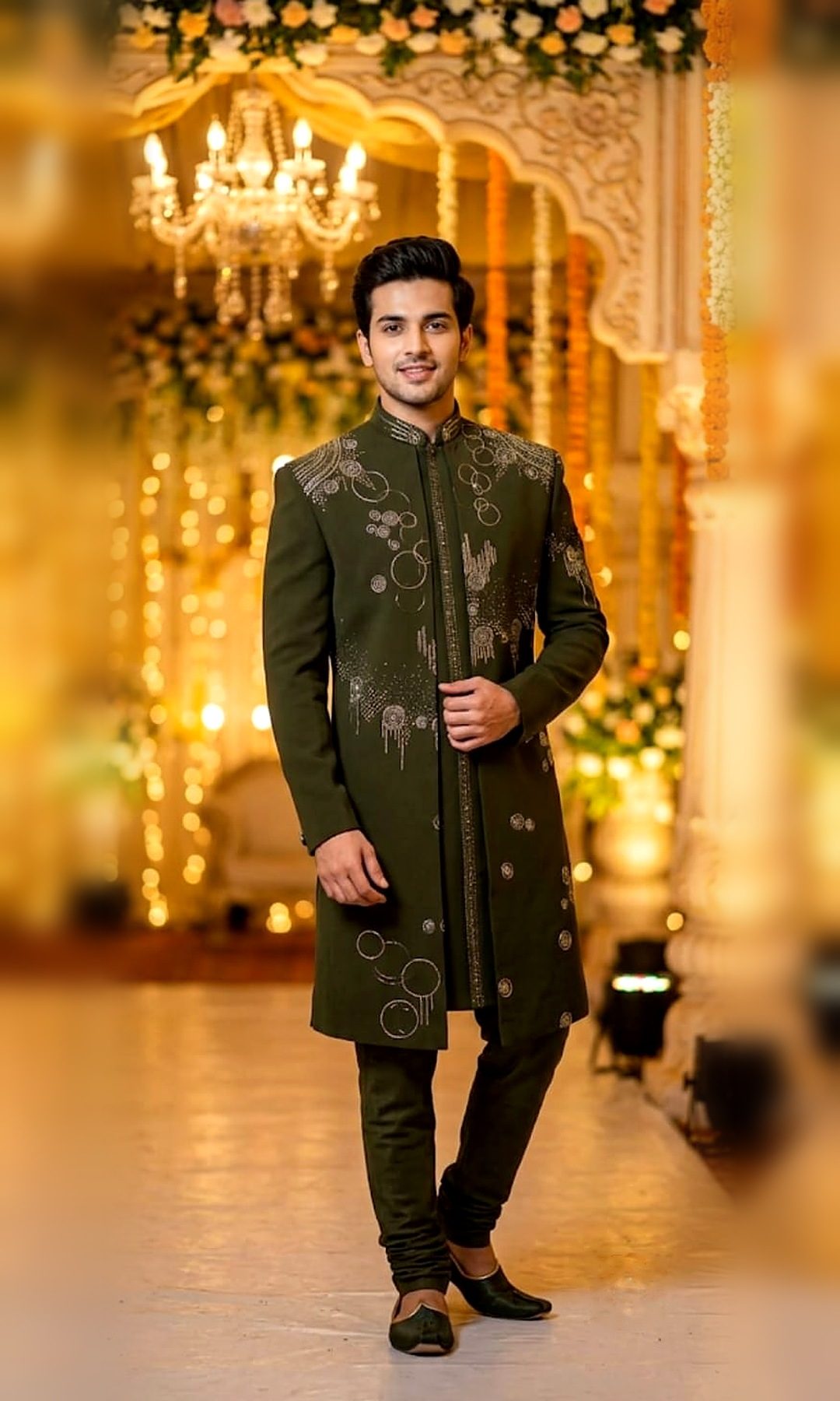 Olive Green Embellished Sherwani — Olive green sherwani with abstract circle-and-sparkle stone embellishment, an embroidered placket and mandarin collar — shown with matching churidar.
