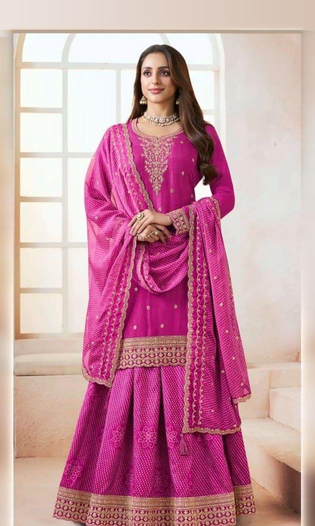 Rani Pink Bandhani Sharara Suit — Rani pink suit with a zari-embroidered yoke, bandhani-print sharara fabric and a matching bandhani dupatta. Unstitched suit set.