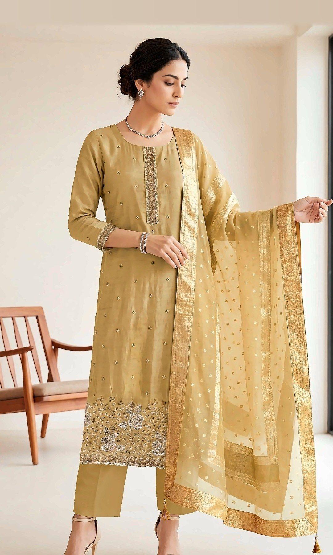 Gold Rose-Embroidered Suit — Soft tissue-silk suit with a sequinned placket, rose-embroidered hem and a woven zari-border dupatta. Unstitched suit set.