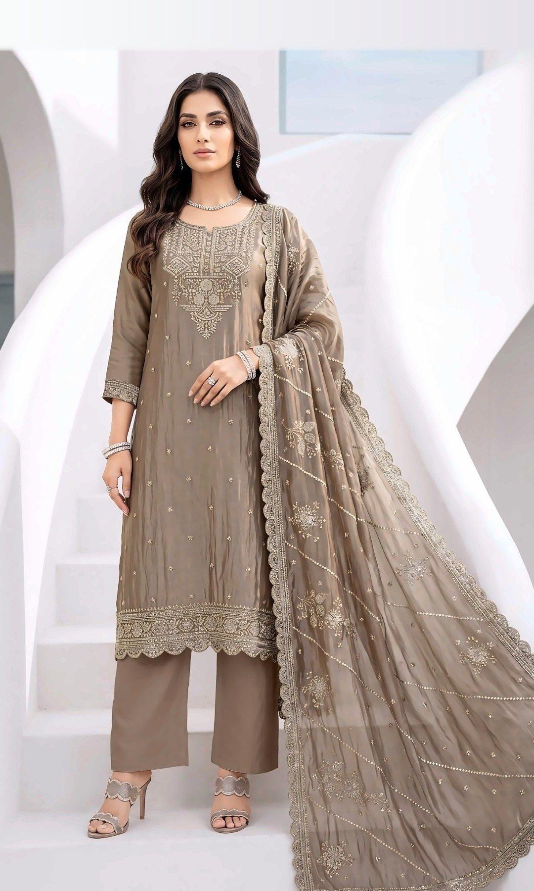 Mocha Tissue Silk Embroidered Suit — Shimmering tissue-silk suit with a rich embroidered yoke, scalloped hem and a sequin-striped scalloped dupatta. Unstitched suit set.